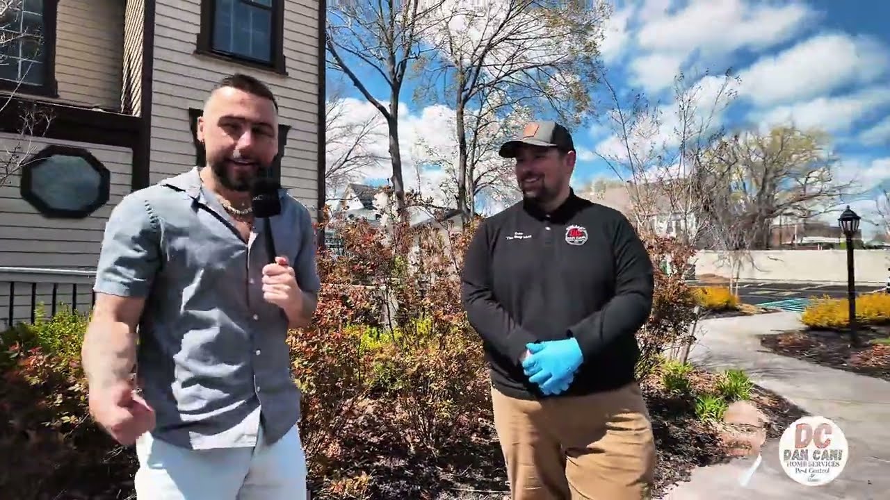 Dan Latini and KChev discussing pest control in new jersey homes and businesses in front of Rebecca Finn house in toms river
